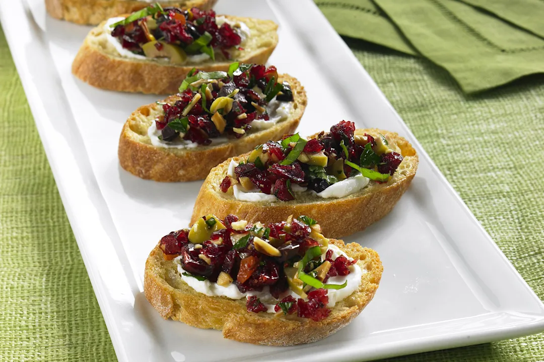 Warm Chevre Crostini with Cranberry Basil Tapenade